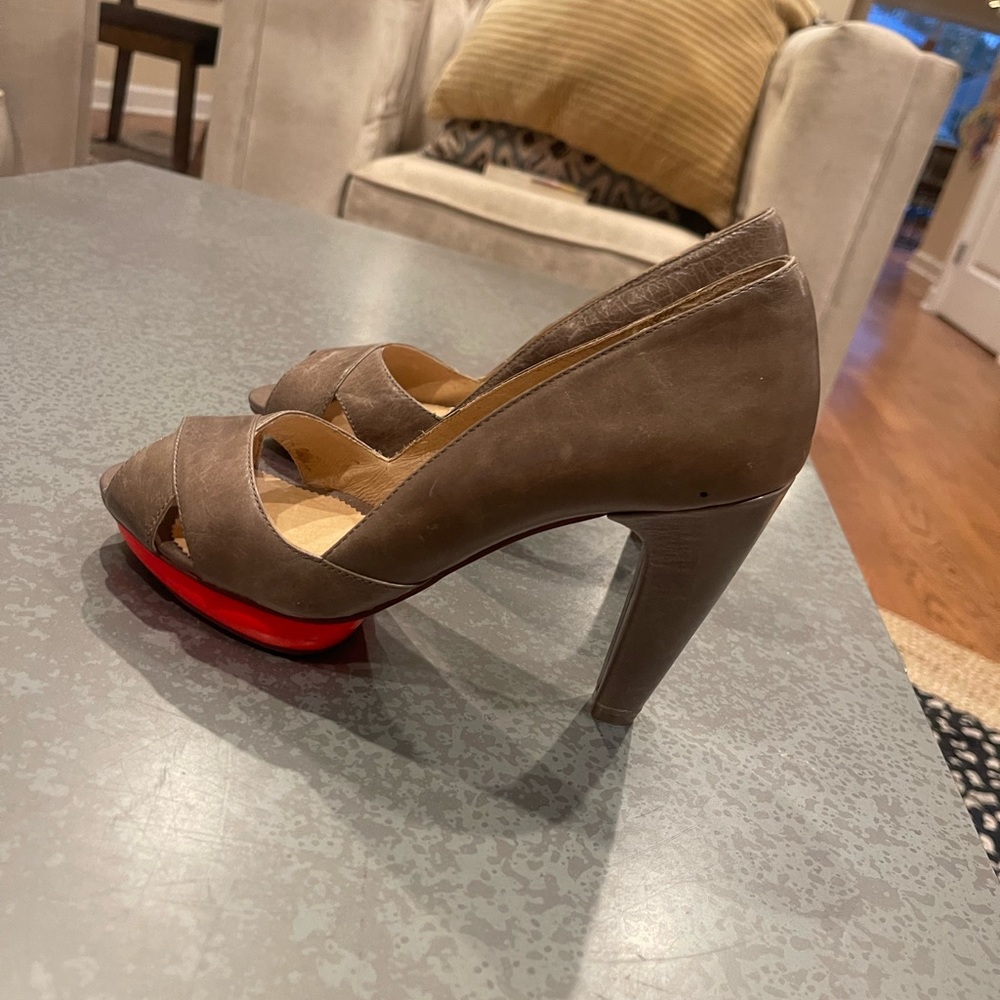 Unique heels. Worn once. Bright colored underneath front of shoe.
